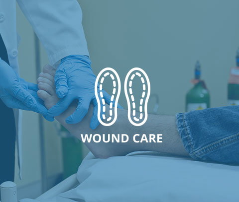 service-wound-care.jpg Medical professional providing wound care to a patient's foot.